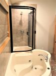 Upper level bathroom with shower and jacuzzi tub